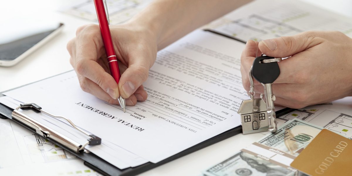 high-angle-man-signing-contract-new-home